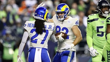 SEATTLE, WASHINGTON - OCTOBER 07: Running back Darrell Henderson #27 of the Los Angeles Rams celebrates with tight end Johnny Mundt #82 after rushing for a second half touchdown against the Seattle Seahawks at Lumen Field on October 07, 2021 in Seattle, W