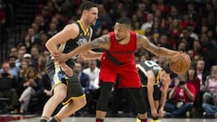 Feb 14, 2018; Portland, OR, USA; Portland Trail Blazers guard Damian Lillard (0) dribbles the ball as he is guarded by Golden State Warriors guard Klay Thompson (11) during the first half at the Moda Center. Mandatory Credit: Troy Wayrynen-USA TODAY Sports