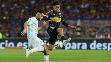 Racing's defender #03 Marco Di Cesare (L) and Boca Juniors' forward #07 Exequiel Zeballos fight for the ball during the Argentine Professional Football League 2025 Clausura Tournament semifinal match between Boca Juniors and Racing at La Bombonera Stadium in Buenos Aires on December 7, 2025. (Photo by ALEJANDRO PAGNI / AFP)