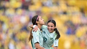 Mexico's forward Montserrat Saldivar (L) celebrates with teammate midfielder Alice Soto after scoring during the 2024 FIFA U-20 Women's World Cup match between Cameroon and Mexico at El Campin stadium in Bogota on August 31, 2024. (Photo by Luis ACOSTA / AFP)