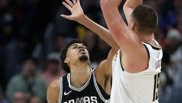 DENVER, COLORADO - JANUARY 03: Nikola Jokic #15 of the Denver Nuggets puts up a shot against Victor Wembanyama #1 of the San Antonio Spurs in the fourth quarter at Ball Arena on January 03, 2025 in Denver, Colorado. NOTE TO USER: User expressly acknowledges and agrees that, by downloading and or using this photograph, User is consenting to the terms and conditions of the Getty Images License Agreement. Matthew Stockman/Getty Images/AFP (Photo by MATTHEW STOCKMAN / GETTY IMAGES NORTH AMERICA / Getty Images via AFP)