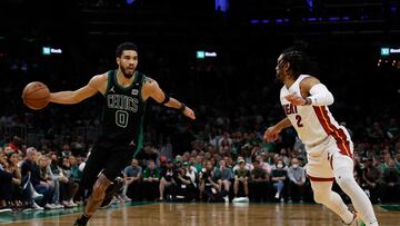 Boston Celtics forward Jayson Tatum moves the ball against Miami Heat guard Gabe Vincent during the second half in game six of the 2022 eastern conference finals at TD Garden.