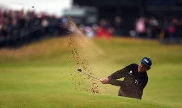 Mickelson plays from a green-side bunker on the 18th on day three of the 2016 British Open.