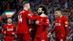 FILE PHOTO: Soccer Football - Premier League - Liverpool v Southampton - Anfield, Liverpool, Britain - February 1, 2020  Liverpool&#039;s Mohamed Salah celebrates scoring their third goal with Jordan Henderson and teammates  REUTERS/Phil Noble  EDITORIAL 
