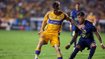 Fernando Gorriaran (R) of Tigres fights for the ball with Cristian Calderon (R) of America during the 3rd round match between Tigres UANL and America as part of the Liga BBVA MX, Torneo Apertura 2024 at Universitario Stadium on July 17, 2024 in Monterrey, Nuevo Leon, Mexico.