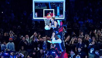 Feb 17, 2024; Indianapolis, IN, USA; Osceola Magic guard Mac McClung (0) dunks the ball over former basketball player Shaquille O'Neal during the slam dunk competition during NBA All Star Saturday Night at Lucas Oil Stadium. Mandatory Credit: Kyle Terada-USA TODAY Sports