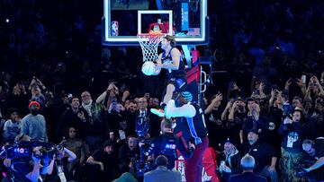 Feb 17, 2024; Indianapolis, IN, USA; Osceola Magic guard Mac McClung (0) dunks the ball over former basketball player Shaquille O'Neal during the slam dunk competition during NBA All Star Saturday Night at Lucas Oil Stadium. Mandatory Credit: Kyle Terada-USA TODAY Sports