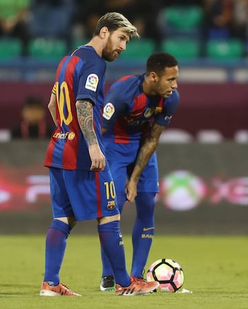 Lionel Messi and Neymar Junior are seen during a friendly football match against Saudi Arabia's Al-Ahli F