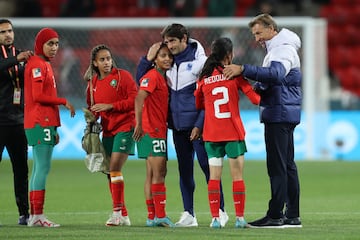 Head coach Herve Renard (R) consoles Morocco players after the FIFA Women's World Cup 2023 Round of 16 match between France and Morocco.
