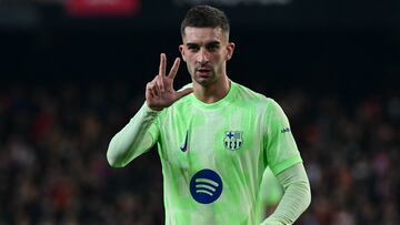 Barcelona's Spanish forward #07 Ferran Torres holds up three fingers after scoring his third goal during the Spanish Copa del Rey (King's Cup) quarter-final first leg football match between Valencia CF and FC Barcelona at Mestalla Stadium in Valencia on February 6, 2025. (Photo by JOSE JORDAN / AFP)