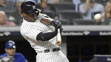 FILE - In this Sept. 14, 2018, file photo, New York Yankees&#039; Andrew McCutchen hits a home run during the fifth inning of a baseball game against the Toronto Blue Jays, at Yankee Stadium in New York. A person familiar with the negotiations tells The Associated Press that All-Star outfielder Andrew McCutchen and the Philadelphia Phillies have agreed to a $50 million three-year contract. The person spoke on condition of anonymity Tuesday, Dec. 11, 2018, because the agreement, which includes a club option for 2022, is subject to a successful physical.(AP Photo/Bill Kostroun, File)