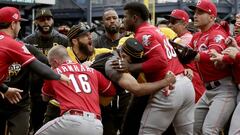 Cincinnati Reds&#039; Yasiel Puig (66) is restrained by Pittsburgh Pirates bench coach Tom Prince, in the middle of a bench clearing brawl during the fourth inning of a baseball game in Pittsburgh, Sunday, April 7, 2019. (AP Photo/Gene J. Puskar)