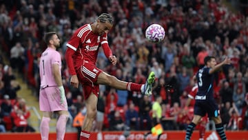 Liverpool's French striker #22 Hugo Ekitike kicks the ball in the air as he celebrates the team's second goal during the second of two pre season friendly football matches between Liverpool and Athletic Bilbao at Anfield in Liverpool, north west England on August 4, 2025. (Photo by Darren Staples / AFP)