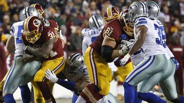 LANDOVER, MD - DECEMBER 7: Running back Matt Jones #31 of the Washington Redskins carries the ball against defensive end Greg Hardy #76 of the Dallas Cowboys in the third quarter at FedExField on December 7, 2015 in Landover, Maryland. Rob Carr/Getty Images/AFP
== FOR NEWSPAPERS, INTERNET, TELCOS & TELEVISION USE ONLY ==