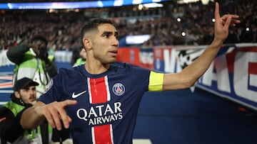 Paris Saint-Germain's Moroccan defender and captain #02 Achraf Hakimi gestures towards PSG fans as he pleads with them to stop singing insulting chants during the French L1 football match between Paris Saint-Germain and Olympique Lyonnais at the Parc des Princes stadium in Paris on December 15, 2024. (Photo by Franck FIFE / AFP)