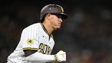 Mar 31, 2025; San Diego, California, USA; San Diego Padres third base Manny Machado (13) hits a single during the third inning against the Cleveland Guardians at Petco Park. Mandatory Credit: Denis Poroy-Imagn Images