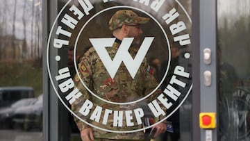 A man wearing a camouflage uniform walks out of PMC Wagner Centre, which is a project implemented by the businessman and founder of the Wagner private military group Yevgeny Prigozhin, during the official opening of the office block in Saint Petersburg, Russia, November 4, 2022. REUTERS/Igor Russak