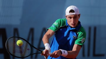 France Ugo Humbert returns a ball to France?s Alexandre Muller during their 2025 ATP Tour Madrid Open tennis tournament third round singles match at the Caja Magica in Madrid, on April 26, 2025. (Photo by Thomas COEX / AFP)