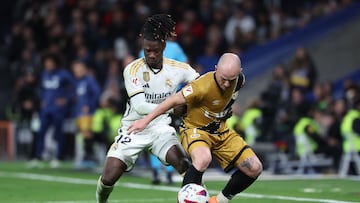 Real Madrid's French midfielder #12 Eduardo Camavinga vies with Rayo Vallecano's Spanish forward #07 Isi Palazon during the Spanish league football match between Real Madrid CF and Rayo Vallecano de Madrid at the Santiago Bernabeu stadium in Madrid on November 5, 2023. (Photo by Pierre-Philippe MARCOU / AFP)