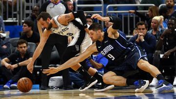 Nov 15, 2019; Orlando, FL, USA;San Antonio Spurs guard Marco Belinelli (18) and Orlando Magic center Nikola Vucevic (9) fight to control the rebound during the second quarter at Amway Center. Mandatory Credit: Kim Klement-USA TODAY Sports