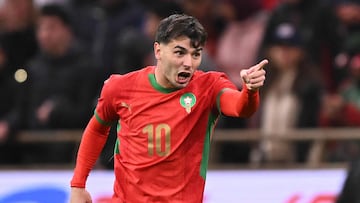 Guest and Morocco's forward #10 Brahim Diaz celebrates scoring his team's first goal during the Africa Cup of Nations (CAN) group A football match between Morocco and Comoros at Prince Moulay Abdellah Stadium in Rabat on December 21, 2025. (Photo by SEBASTIEN BOZON / AFP)
