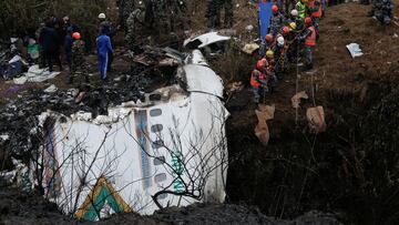 A rescue team works to recover the body of a victim from the site of the plane crash of a Yeti Airlines operated aircraft, in Pokhara, Nepal January 16, 2023. REUTERS/Rohit Giri NO RESALES. NO ARCHIVES