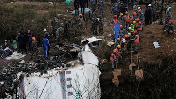 A rescue team works to recover the body of a victim from the site of the plane crash of a Yeti Airlines operated aircraft, in Pokhara, Nepal January 16, 2023. REUTERS/Rohit Giri NO RESALES. NO ARCHIVES