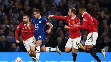 LONDON, ENGLAND - OCTOBER 22: Cesar Azpilicueta of Chelsea runs with the ball from Luke Shaw, Christian Eriksen and Casemiro of Manchester United during the Premier League match between Chelsea FC and Manchester United at Stamford Bridge on October 22, 2022 in London, England. (Photo by Darren Walsh/Chelsea FC via Getty Images)