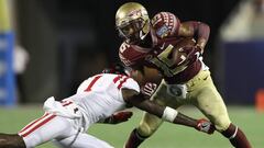 ORLANDO, FL - SEPTEMBER 05: Travis Rudolph #15 of the Florida State Seminoles is tackled by Tony Bridges #1 of the Mississippi Rebels in the second half during the Camping World Kickoff at Camping World Stadium on September 5, 2016 in Orlando, Florida.   Streeter Lecka/Getty Images/AFP
 == FOR NEWSPAPERS, INTERNET, TELCOS &amp; TELEVISION USE ONLY ==