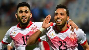 Bahrain's defender Jamal Rashid (R) celebrates with his teammate midfielder Kumil Hasan Abdullah after scoring a goal from a penalty shot against Yemen during their 2017 Gulf Cup of Nations group match at Al Kuwait Sports Club Stadium in Kuwait City