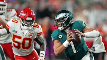 Feb 12, 2023; Glendale, Arizona, US; Philadelphia Eagles quarterback Jalen Hurts (1) scrambles with the ball against Kansas City Chiefs linebacker Willie Gay (50) during the fourth quarter of Super Bowl LVII at State Farm Stadium. Mandatory Credit: Kirby Lee-USA TODAY Sports