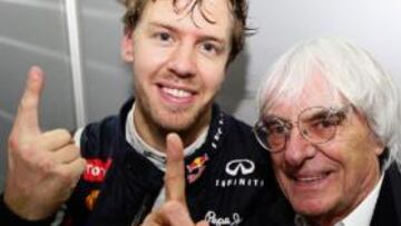 Vettel y Ecclestone celebran el título del alemán.