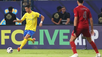 Nassr's Portuguese forward #07 Cristiano Ronaldo run to shoot the ball as Duhail's Qatari defender #04 Yousef Aymen