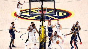 DENVER, CO - JANUARY 17: Nikola Jokic #15 of the Denver Nuggets defends against Donovan Mitchell #45 of the Utah Jazz at Ball Arena on January 17, 2021 in Denver, Colorado. NOTE TO USER: User expressly acknowledges and agrees that, by downloading and/or using this photograph, user is consenting to the terms and conditions of the Getty Images License Agreement   Jamie Schwaberow/Getty Images/AFP
 == FOR NEWSPAPERS, INTERNET, TELCOS &amp; TELEVISION USE ONLY ==