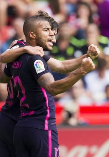 GIJON, SPAIN - SEPTEMBER 24: Rafinha of FC Barcelona celebrates after scoring his team's second goal during the La Liga match between Real Sporting de Gijon and FC Barcelona at Estadio El Molinon on September 24, 2016 in Gijon, Spain.  (Photo by Juan Manu