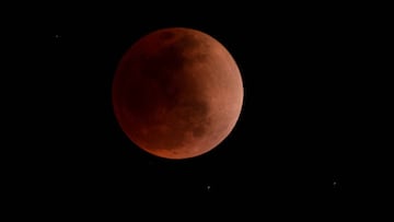 The blood moon is seen during a total lunar eclipse in Canta, east of Lima on May 15, 2022. (Photo by ERNESTO BENAVIDES / AFP) (Photo by ERNESTO BENAVIDES/AFP via Getty Images)