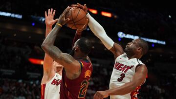 Mar 27, 2018; Miami, FL, USA; Miami Heat guard Dwyane Wade (3) knocks the ball from Cleveland Cavaliers forward LeBron James (23) during the first half at American Airlines Arena. Mandatory Credit: Jasen Vinlove-USA TODAY Sports