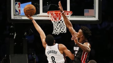 Jan 10, 2020; Brooklyn, New York, USA; Brooklyn Nets guard Spencer Dinwiddie (8) shoots against Miami Heat forward Jimmy Butler (22) during the first half at Barclays Center. Mandatory Credit: Andy Marlin-USA TODAY Sports