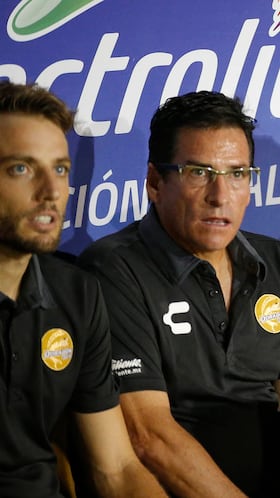 Diego Maradona, head coach of Dorados de Sinaloa soccer team, second from right, sits with his coaching staff on the sidelines of a second-tier national league soccer match against Cafetaleros, his first game as coach for Dorados in Culiacan, Mexico, Monday, Sept. 17, 2018. (AP Photo/Eduardo Verdugo)