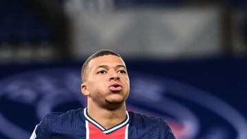 Paris Saint-Germain's French forward Kylian Mbappe celebrates scoring his team's third goal during the French L1 football match between Paris Saint-Germain (PSG) and Dijon at the Parc de Princes stadium in Paris on October 24, 2020. (Photo by FR