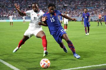 CHARLOTTE, NORTH CAROLINA - JULY 02: DeJuan Jones #15 of the United States and Levi Garc�a #11 of Trinidad and Tobago fight for control of the ball during the second half of the Concacaf Gold Cup match at Bank of America Stadium on July 02, 2023 in Charlotte, North Carolina.   David Jensen/Getty Images/AFP (Photo by David Jensen / GETTY IMAGES NORTH AMERICA / Getty Images via AFP)