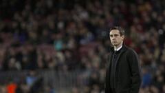 Valencia coach Gary Neville looks on during his side&#039;s thumping at Barcelona.