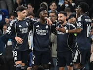 Real Madrid's Brazilian forward #07 Vinicius Junior (2L) celebrates after scoring their late second goal during the UEFA Champions League, round of 16 second leg football match between Manchester City and Real Madrid at the Etihad Stadium in Manchester, north west England, on March 17, 2026. (Photo by Paul ELLIS / AFP)