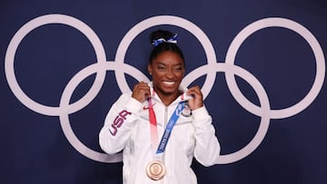 TOKYO, JAPAN - AUGUST 03: Simone Biles of Team United States poses with the bronze medal following the Women's Balance Beam Final on day eleven of the Tokyo 2020 Olympic Games at Ariake Gymnastics Centre on August 03, 2021 in Tokyo, Japan. (Photo by Jamie Squire/Getty Images)