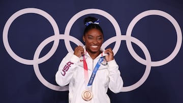 TOKYO, JAPAN - AUGUST 03: Simone Biles of Team United States poses with the bronze medal following the Women&#039;s Balance Beam Final on day eleven of the Tokyo 2020 Olympic Games at Ariake Gymnastics Centre on August 03, 2021 in Tokyo, Japan. (Photo by Jamie Squire/Getty Images)