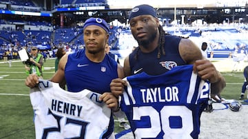 Jonathan Taylor #28 of the Indianapolis Colts and Derrick Henry #22 of the Tennessee Titans