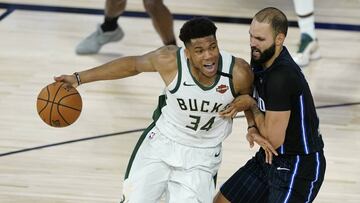 Milwaukee Bucks&#039; Giannis Antetokounmpo (34) drives past Orlando Magic&#039;s Evan Fournier (10) during the second half of an NBA basketball first round playoff game Monday, Aug. 24, 2020, in Lake Buena Vista, Fla. (AP Photo/Ashley Landis, Pool)