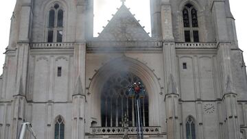 French firefighters battle a blaze at the Cathedral of Saint Pierre and Saint Paul in Nantes, France, July 18, 2020. REUTERS/Stephane Mahe