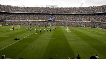 Thousands of Argentina's Boca Juniors fans watch a training session of their team, from the stands of the Bombonera stadium, in Buenos Aires, Argentina Thursday, Nov. 22, 2018. Boca Juniors faces River Plate for the Copa Libertadores soccer final game on Saturday. (AP Photo/Natacha Pisarenko)