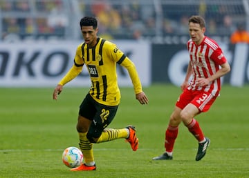 Jude Bellingham carries the ball in a match between Borussia Dortmund and Union Berlin in April.